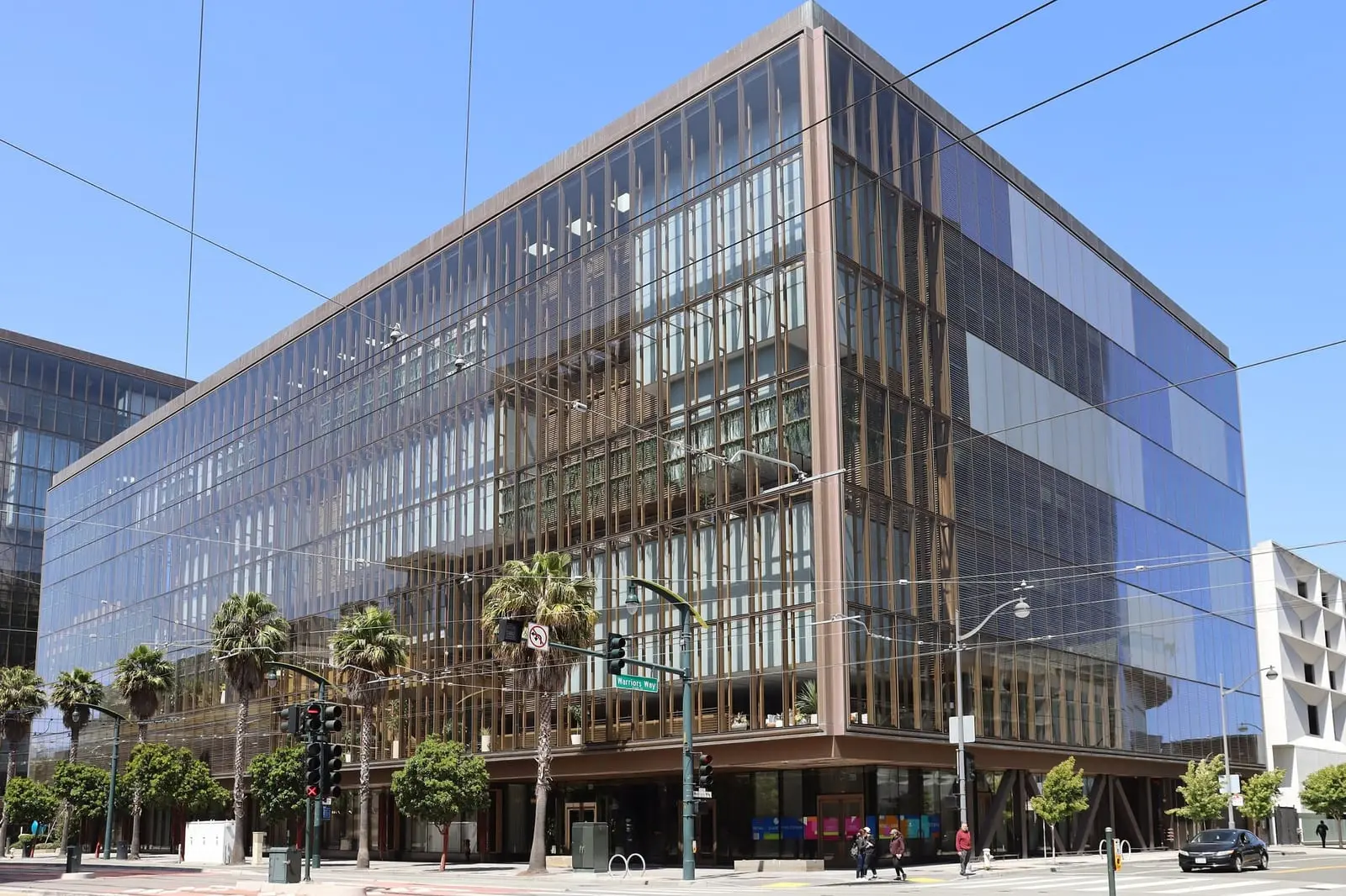A glass office building at 1515 Third Street in the Mission Bay neighborhood of San Francisco on a clear day.